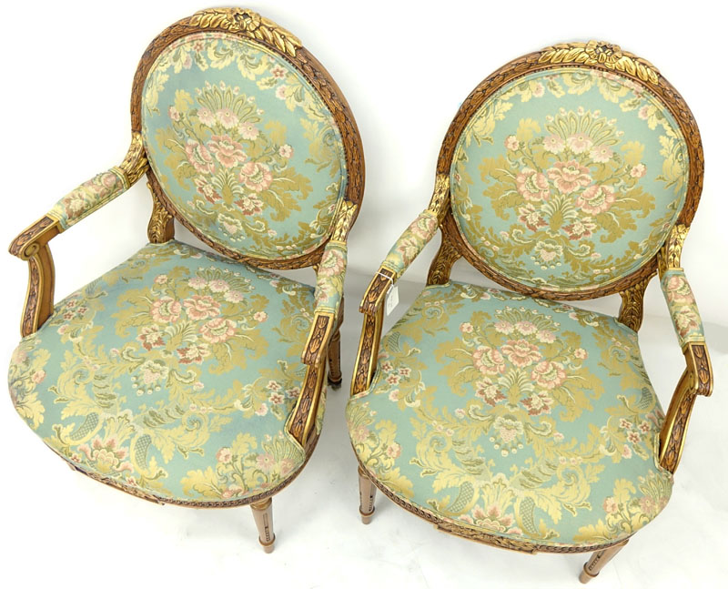 Pair of Karges Carved Parcel Gilt Wood Upholstered Louis XIV Style Fauteuils.