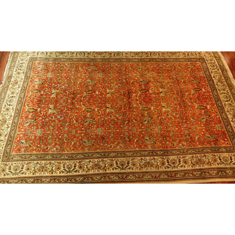 Large Semi Antique Karastan Persian Rug. Floral motif with hunting scenes.