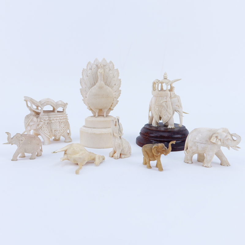 Collection of Nine (9) Carved Ivory Animals. Includes elephants, bird, horse, foo lion. 