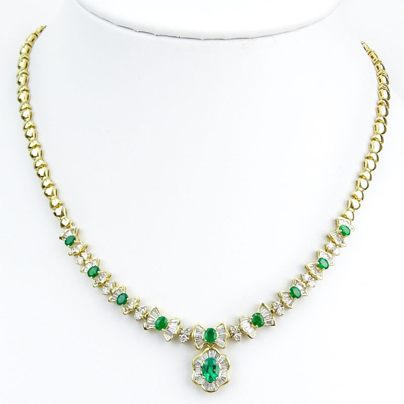 Vintage Approx. 2.20 Carat Baguette and Round Brilliant Cut Diamond, Oval Cut Emerald and 14 Karat Yellow Gold Pendant Necklace.