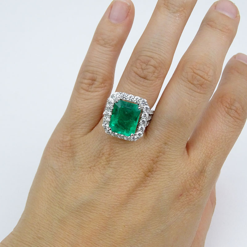 GIA Certified 7.20 Carat Colombian Emerald, 2.58 Carat Round Brilliant Cut Diamond and 18 Karat White Gold Ring.