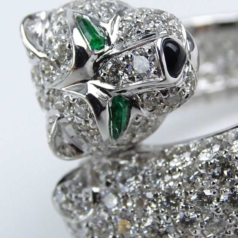 Cartier style Approx. 6.08 Carat Micro Pave Set Round Brilliant Cut Diamond and 18 Karat White Gold Panther Ring with Emerald Eye Accents.