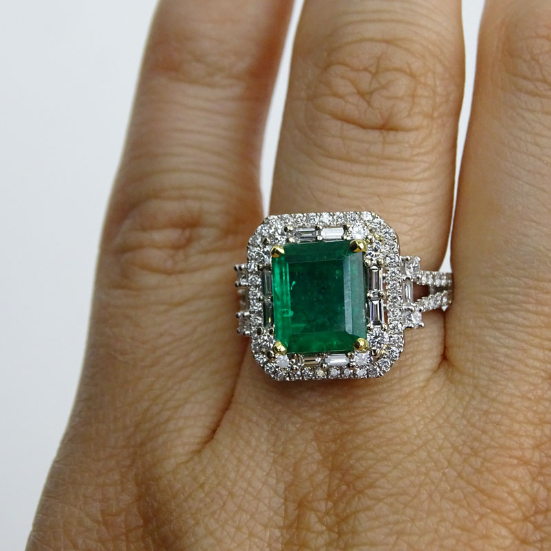 Approx. 2.50 Carat Colombian Emerald, 1.40 Carat Round Brilliant and Baguette Cut Diamond and 18 Karat White Gold Ring. 