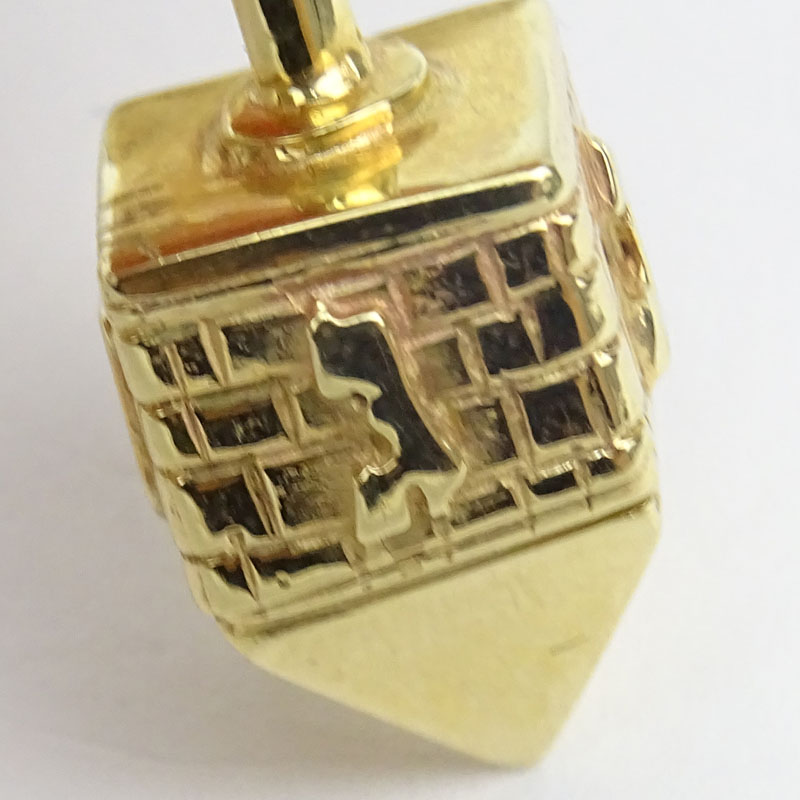 Vintage 14 Karat Yellow Gold Dreidel Pendant and 14 Karat Yellow Gold Torah Pendant with Diamond Accent.