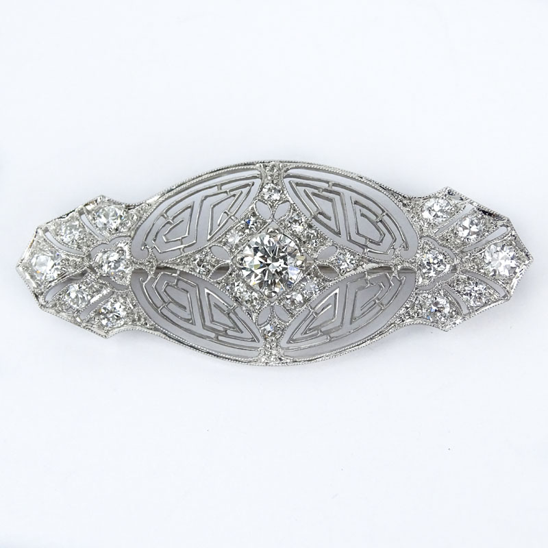  1.50 Carat TW Round Cut Diamond and 14 Karat Filigree White Gold Brooch. Diamonds H-I color, VS1 clarity.