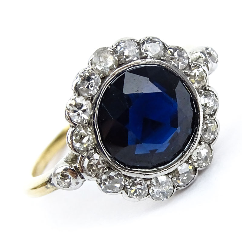  3.0 Carat Round Cut Sapphire, 1.0 Carat Round Cut Diamond, Platinum and 18 Karat Yellow Gold Ring. 