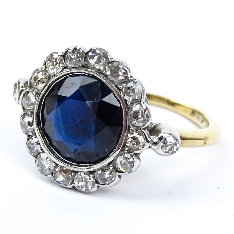  3.0 Carat Round Cut Sapphire, 1.0 Carat Round Cut Diamond, Platinum and 18 Karat Yellow Gold Ring. 