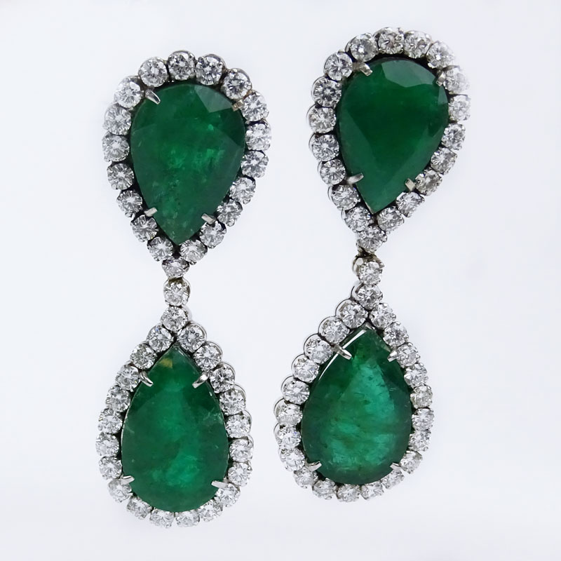  70.0 Carat Pear Shape Colombian Emerald, 11.0 Carat Round Brilliant Cut Diamond  and Platinum Pendant Earrings.