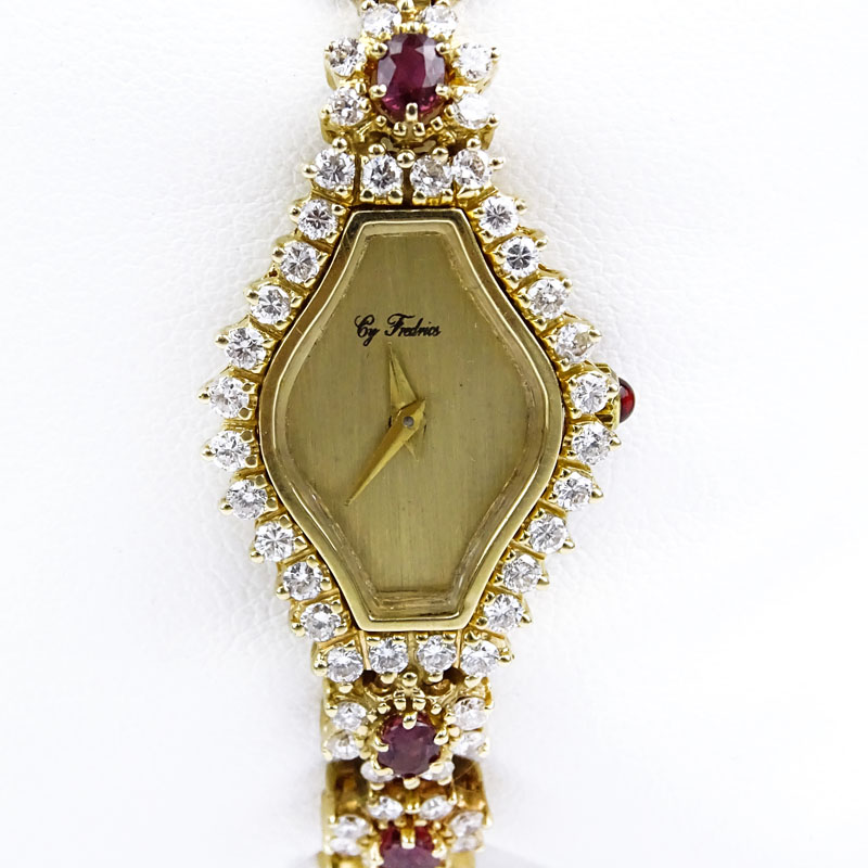 5.50 Carat Round Brilliant Cut Diamond, 4.50 Carat Oval Cut Ruby and 14 Karat Yellow Gold Bracelet Watch with Quartz Movement.