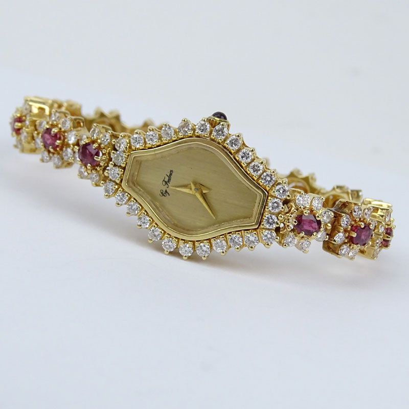 5.50 Carat Round Brilliant Cut Diamond, 4.50 Carat Oval Cut Ruby and 14 Karat Yellow Gold Bracelet Watch with Quartz Movement.