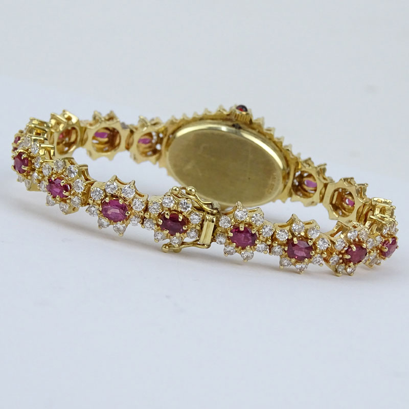 5.50 Carat Round Brilliant Cut Diamond, 4.50 Carat Oval Cut Ruby and 14 Karat Yellow Gold Bracelet Watch with Quartz Movement.