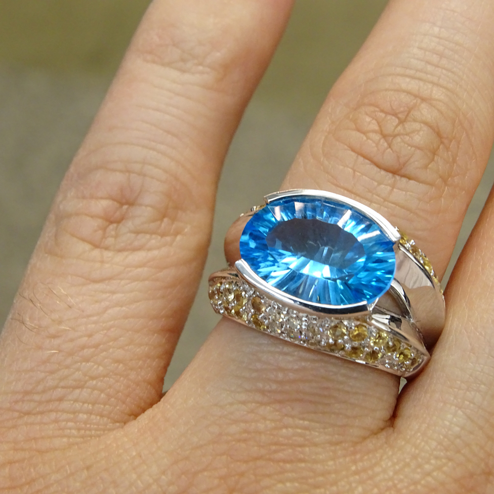 Oval Cut London Blue Topaz, Pave Set Yellow and White Diamond and 14 Karat White Gold Ring