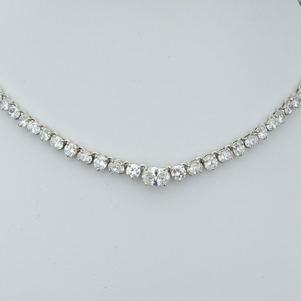 25.0 Carat Eighty-Five (85) Alternating Round Brilliant and Oval Cut Diamond and 14 Karat White Gold Riviera Necklace.