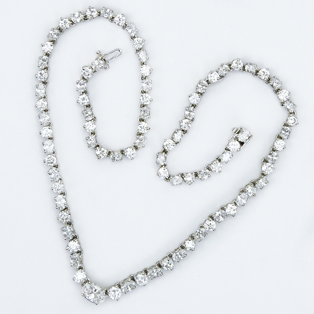 25.0 Carat Eighty-Five (85) Alternating Round Brilliant and Oval Cut Diamond and 14 Karat White Gold Riviera Necklace.