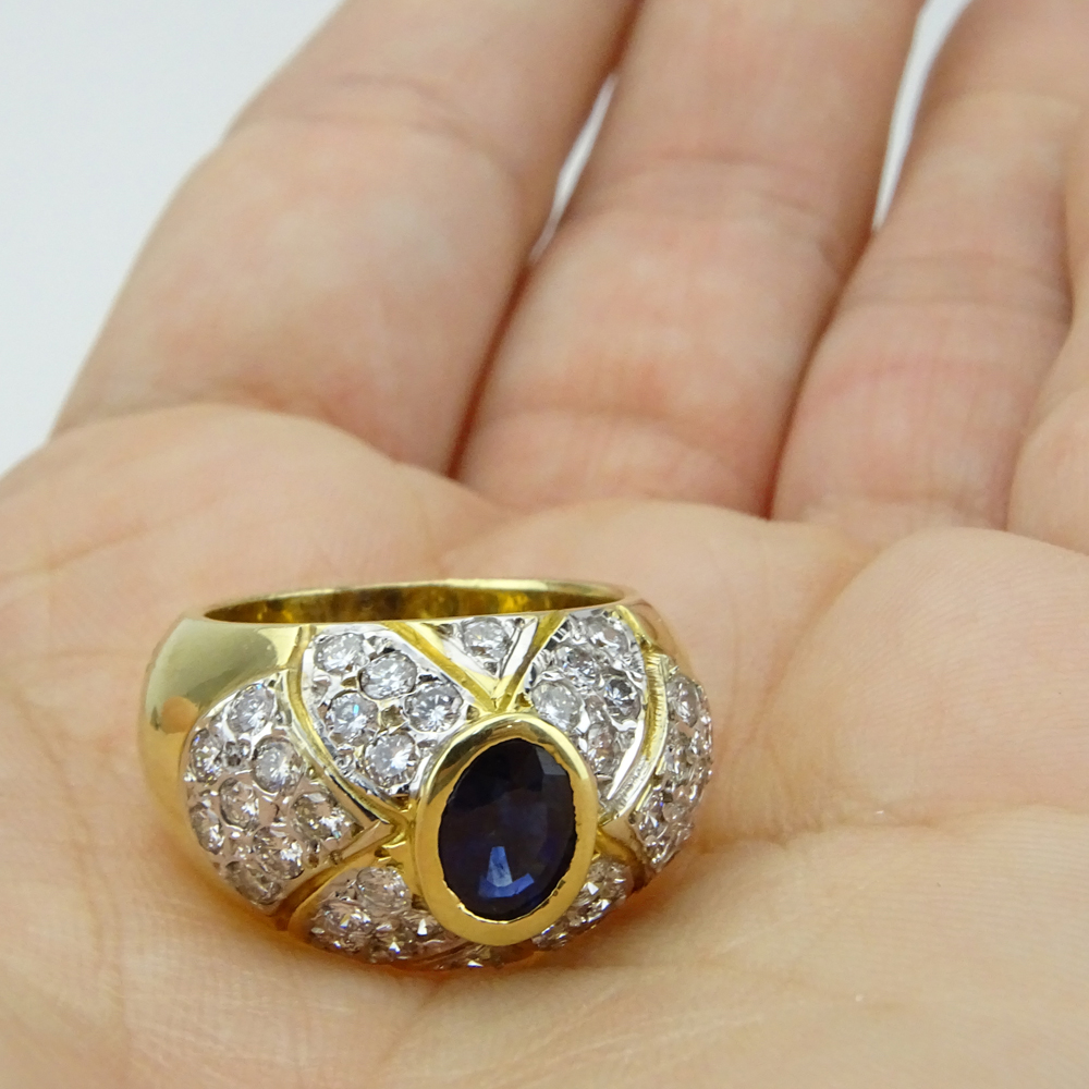  1.0 Carat Oval Cut Sapphire, 1.52 Carat Pave Set Diamond and 14 Karat Yellow Gold Ring. 