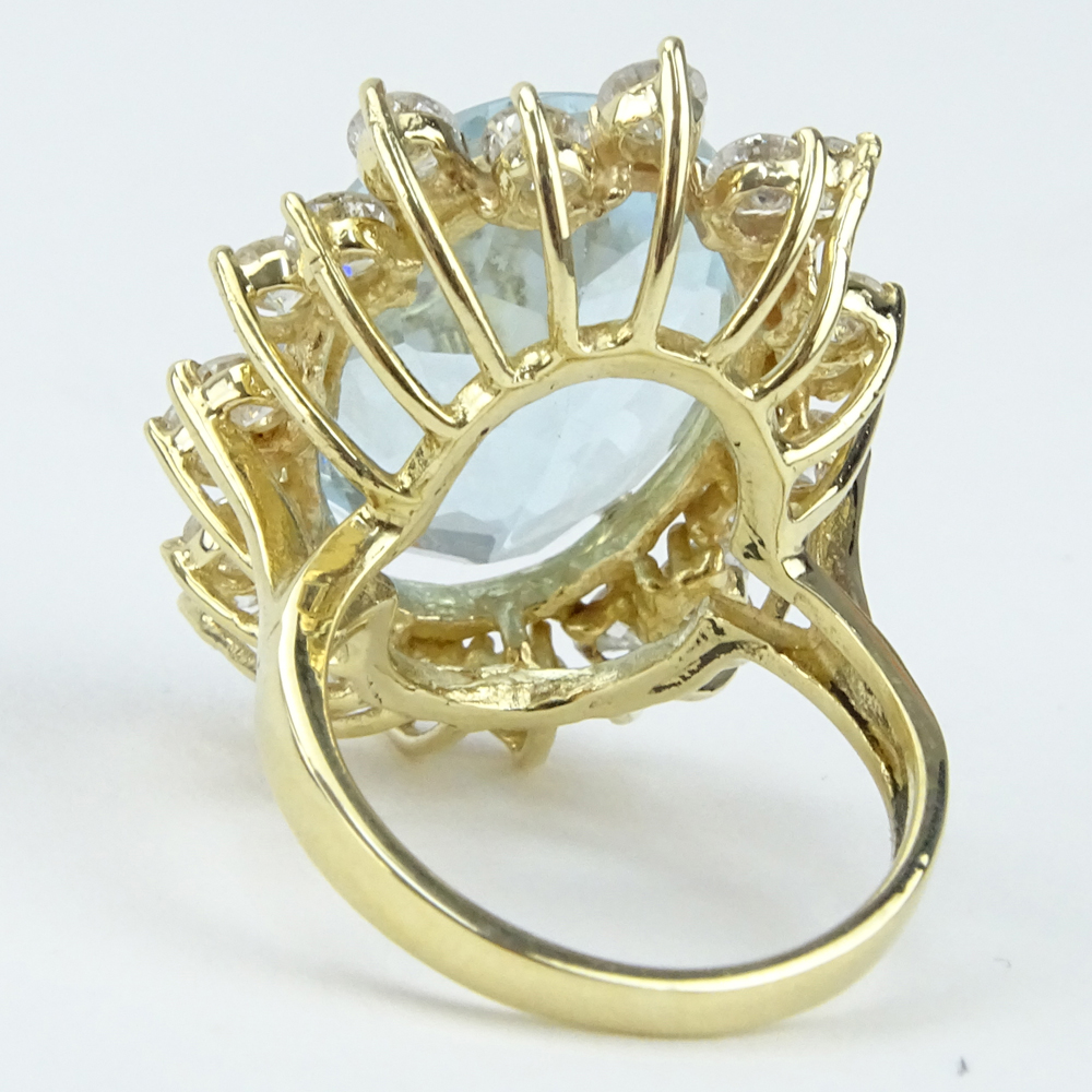 13.70 Carat Oval Cut Aquamarine,  2.25 Carat Round Brilliant Cut Diamond and 14 Karat Yellow Gold Ring. 