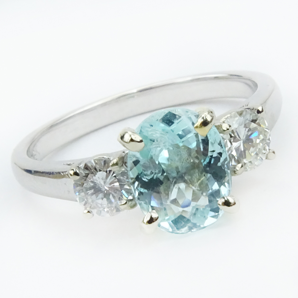  1.73 Carat Oval Cut Light Greenish Blue Paraiba Tourmaline, Diamond and 18 Karat White Gold Ring. 