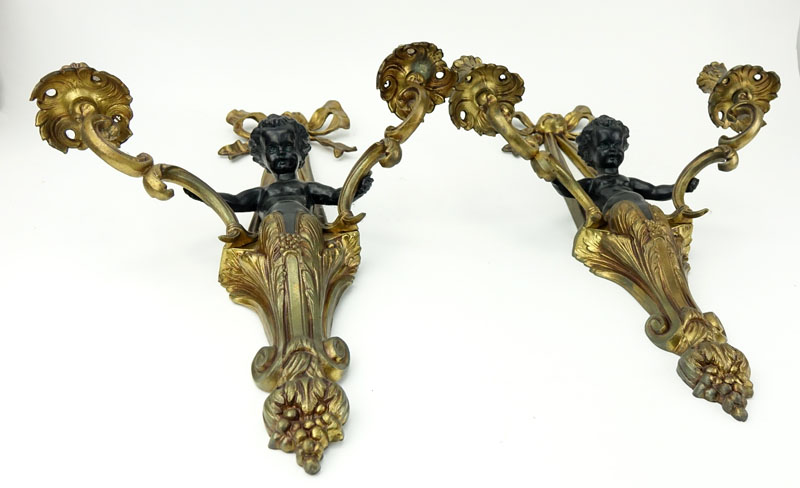 Pair of Louis XVI Style Gilt Bronze Figural Sconces