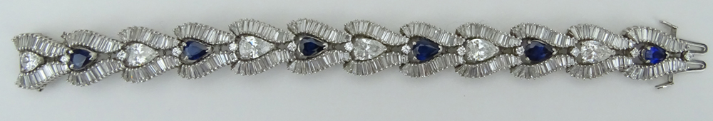 1950s Approx. 21.0 Carat Pear Shape and Baguette Cut Diamond, 4.8 Carat Pear Shape Sapphire and Platinum Bracelet. 