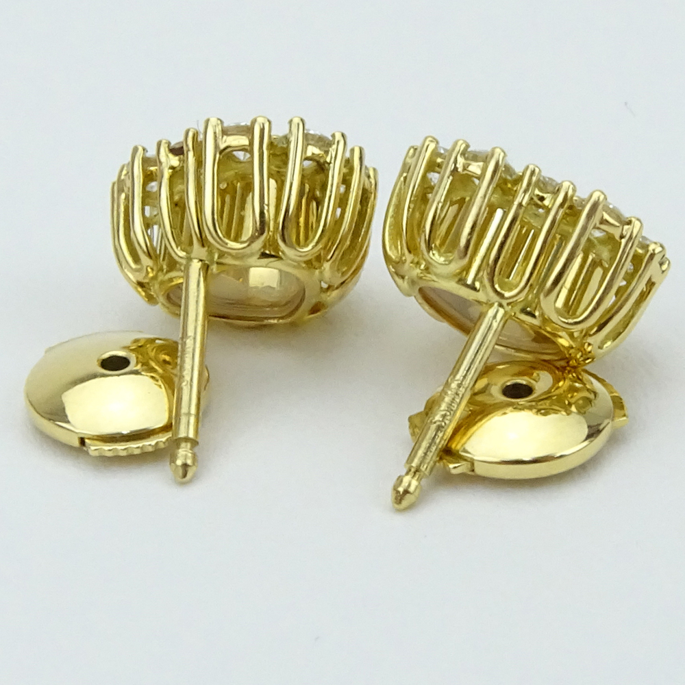 1.10 Carat Round Brilliant Cut Diamond and 18 Karat Yellow Gold Hearts Earrings.