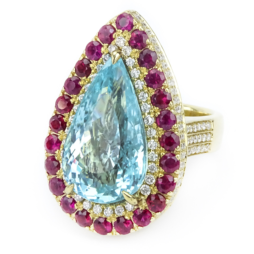 11.70 Carat Pear Shape Paraiba Tourmaline, Diamond, Ruby and 18 Karat Yellow Gold Ring. 