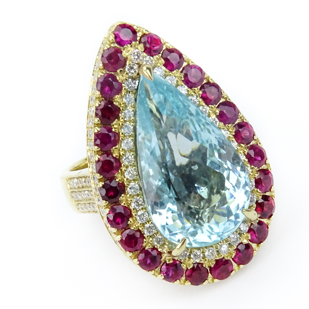 11.70 Carat Pear Shape Paraiba Tourmaline, Diamond, Ruby and 18 Karat Yellow Gold Ring. 