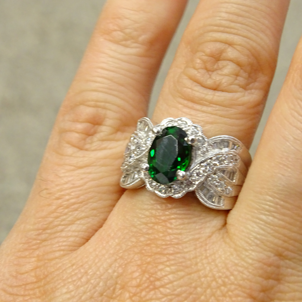 2.50 Carat Oval Cut Tsavorite Garnet, .84 carat Diamond and Platinum Ring.