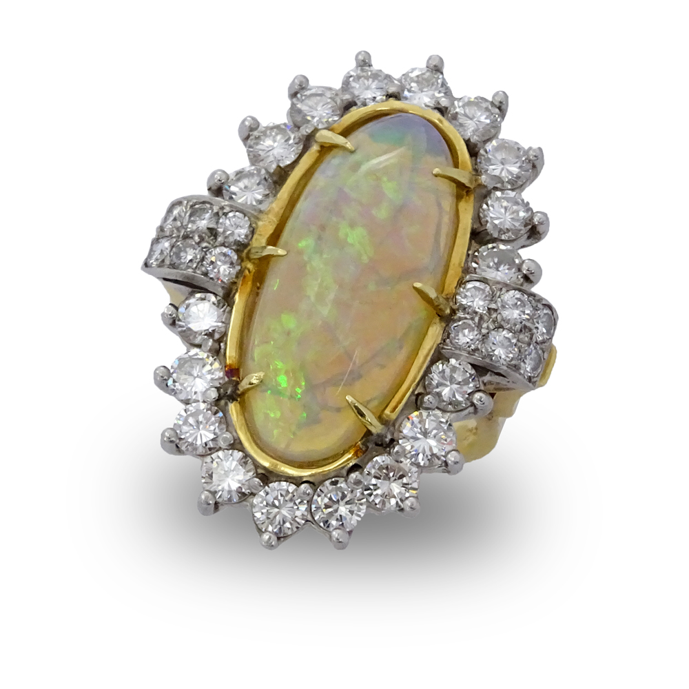 Circa 1970s Oval Cabochon Opal, Diamond, Platinum and 18 Karat Yellow Gold Ring