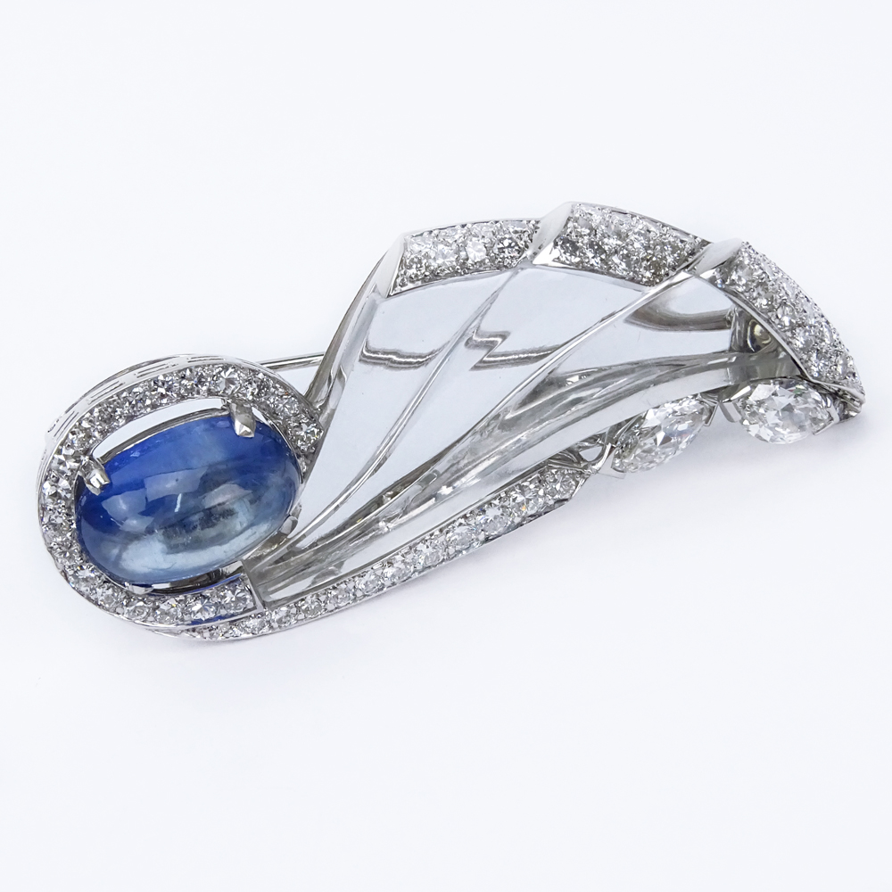  10.03 Carat Oval Cabochon No Heat Burma Sapphire, Diamond, 18 Karat White Gold and Carved Crystal Brooch.