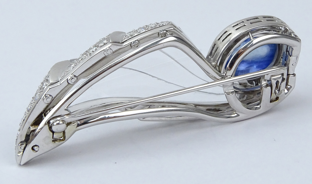  10.03 Carat Oval Cabochon No Heat Burma Sapphire, Diamond, 18 Karat White Gold and Carved Crystal Brooch.