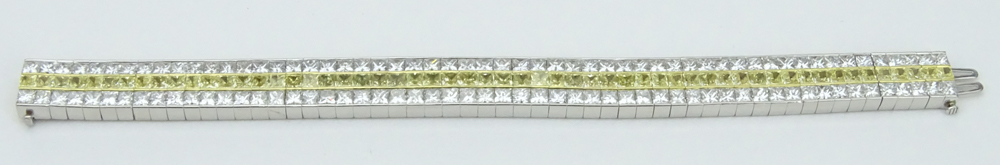 Kwiat Collection, New York Approx. 41.25 Carat One Hundred Sixty Five (165) Princess Cut Fancy Intense Yellow and White Diamond, Platinum and 18 Karat Yellow Gold Bracelet.