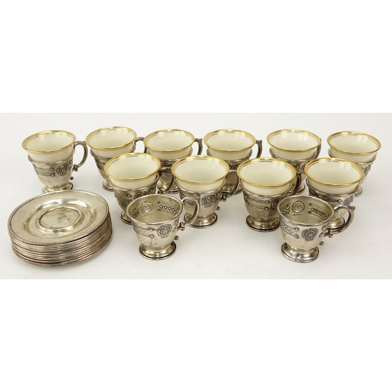 Set of Sterling and Porcelain Demitasse Cups and Saucers