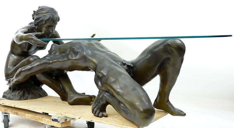 A Bronze Art Deco style Female and Male Nude Figural Glass Top Coffee Table