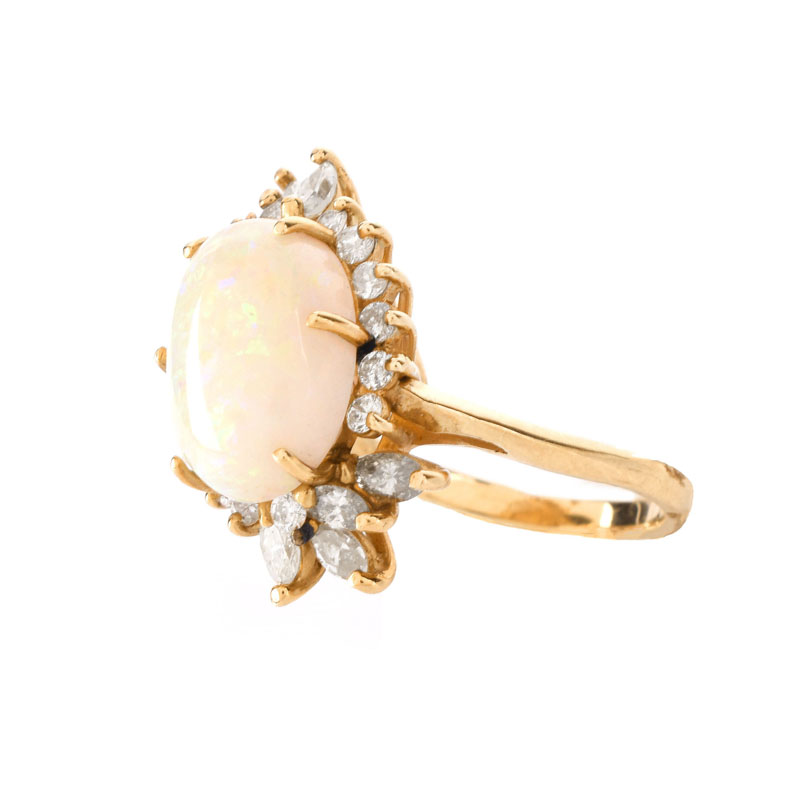 Vintage Approx. 5.0 Carat Oval Cabochon Opal, 1.25 Carat Diamond and 14 Karat Yellow Gold Ring