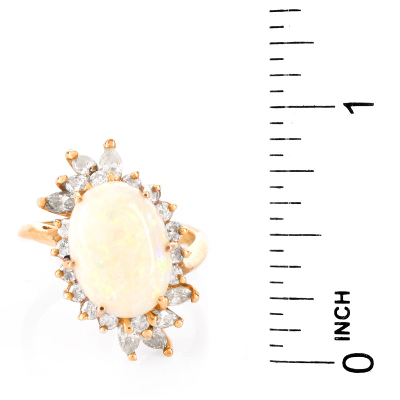 Vintage Approx. 5.0 Carat Oval Cabochon Opal, 1.25 Carat Diamond and 14 Karat Yellow Gold Ring