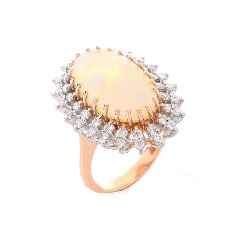 Vintage Approx. 4.60 Carat Oval Cabochon Opal, 1.0 Carat Round Brilliant Cut Diamond and 14 Karat Yellow Gold Ring