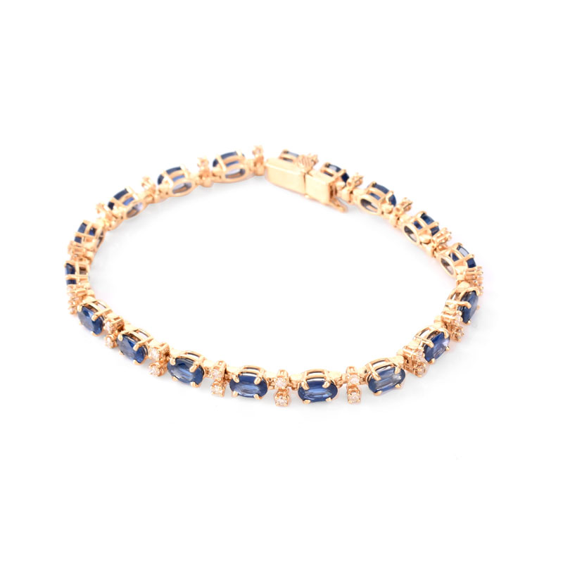 Vintage Oval Cut Synthetic Sapphire, Round Brilliant Cut Diamond and 14 Karat Yellow Gold Line Bracelet