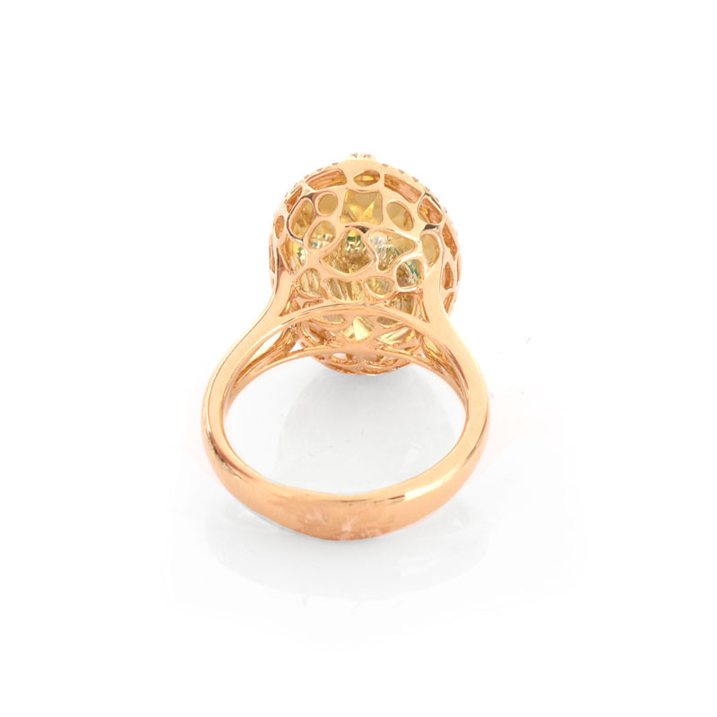 9.52 Carat Oval Cut Heliodor, .44 Carat Oval Cut Emerald, .23 Carat Diamond and 18 Karat Yellow Gold Ring