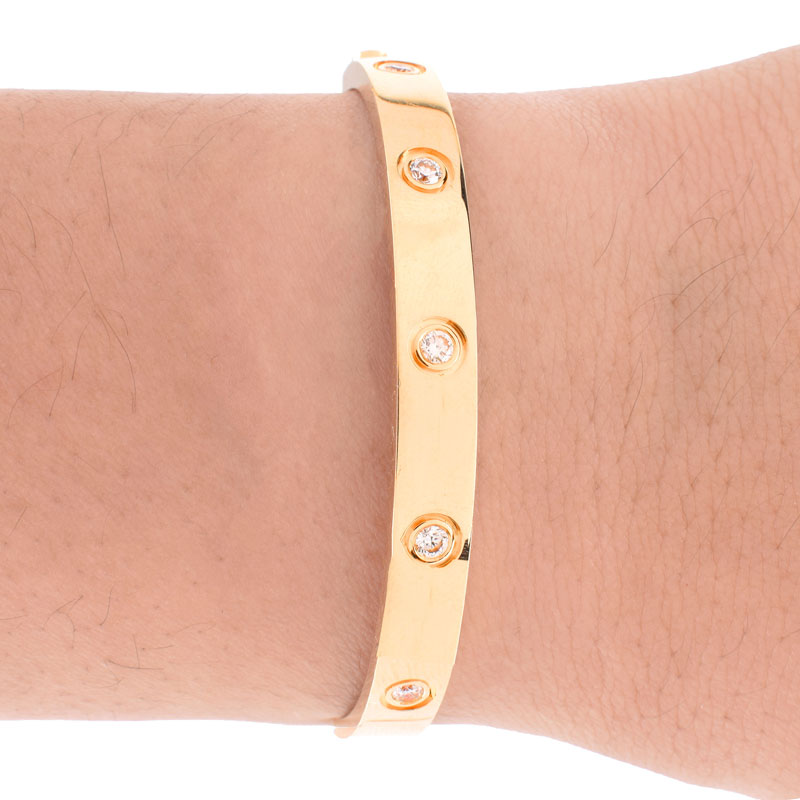 Cartier 18 Karat Yellow Gold and Ten (1) Round Brilliant Cut Diamond Love Bracelet