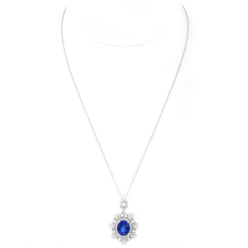 Approx. 5.56 Carat Oval Cut Sapphire, 2.28 Carat Baguette and Round Brilliant Cut Diamond and 18 Karat White Gold Pendant Necklace