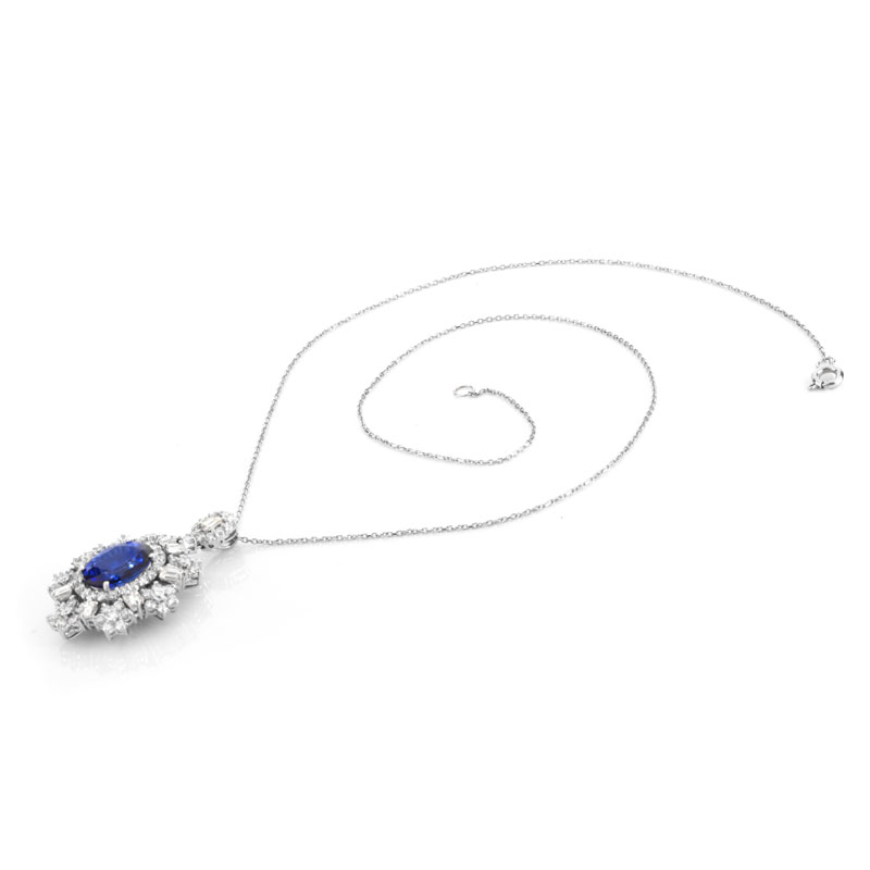 Approx. 5.56 Carat Oval Cut Sapphire, 2.28 Carat Baguette and Round Brilliant Cut Diamond and 18 Karat White Gold Pendant Necklace