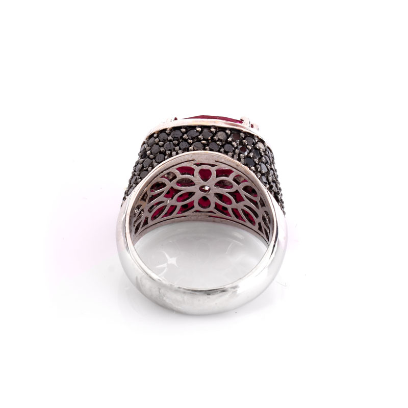 Approx. 5.11 Carat Oval Cut Ruby, 3.50 Carat Micro Pave Set Black Diamond, .61 Carat Round Brilliant Cut Diamond and 18 Karat White Gold Ring