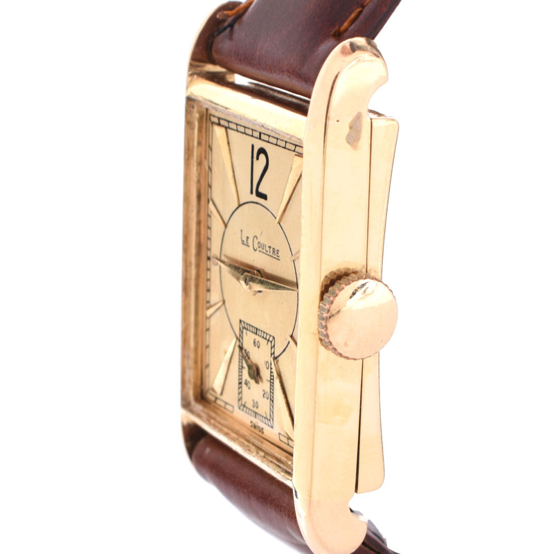 Lady's Vintage LeCoultre 14 Karat Yellow Gold Tank Watch with Leather Strap. Case measures 27mm x 20mm.