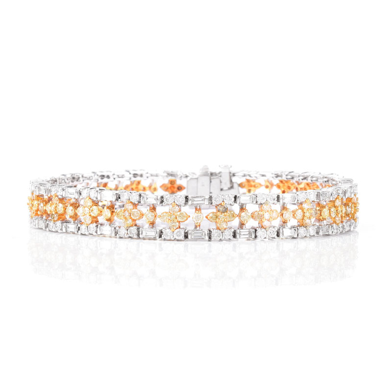 Approx. 3.90 Carat TW Round Brilliant and Baguette Cut White Diamond, 3.25 Carat Round Brilliant Cut Fancy Yellow Diamond and 18 Karat White Gold Bracelet. 