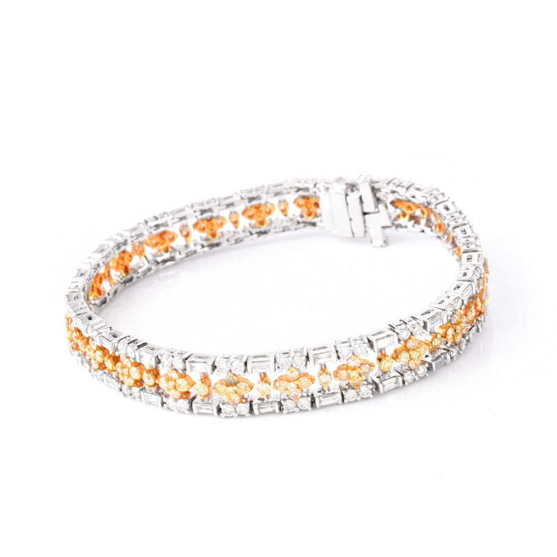 Approx. 3.90 Carat TW Round Brilliant and Baguette Cut White Diamond, 3.25 Carat Round Brilliant Cut Fancy Yellow Diamond and 18 Karat White Gold Bracelet. 