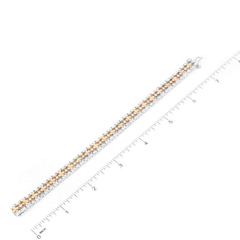 Approx. 3.90 Carat TW Round Brilliant and Baguette Cut White Diamond, 3.25 Carat Round Brilliant Cut Fancy Yellow Diamond and 18 Karat White Gold Bracelet. 