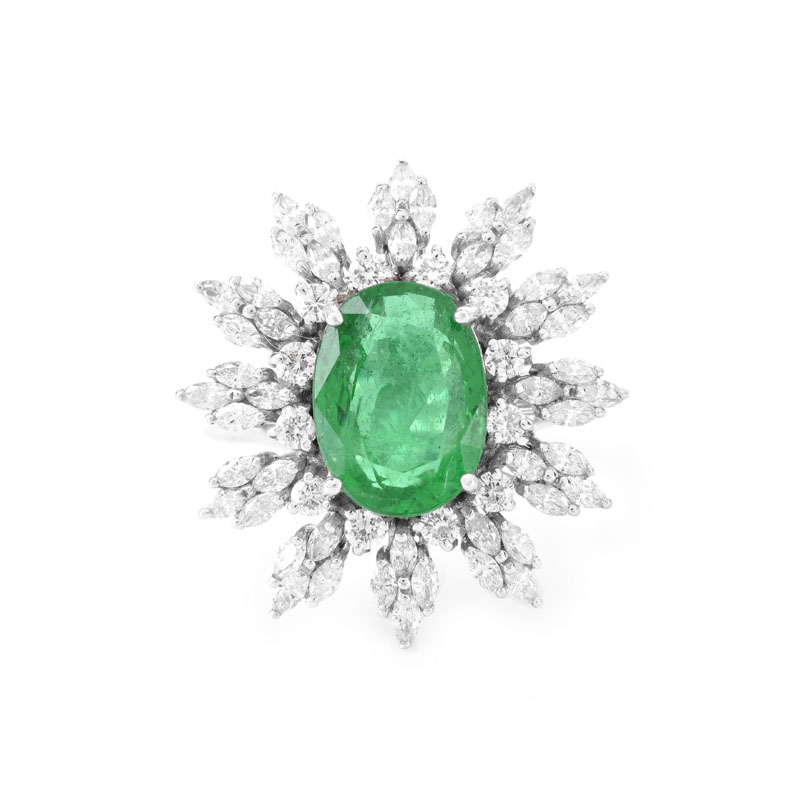 Approx. 5.30 Carat Oval Cut Emerald, 1.95 Carat TW Marquise and Round Brilliant Cut Diamond and 18 Karat White Gold Ring.