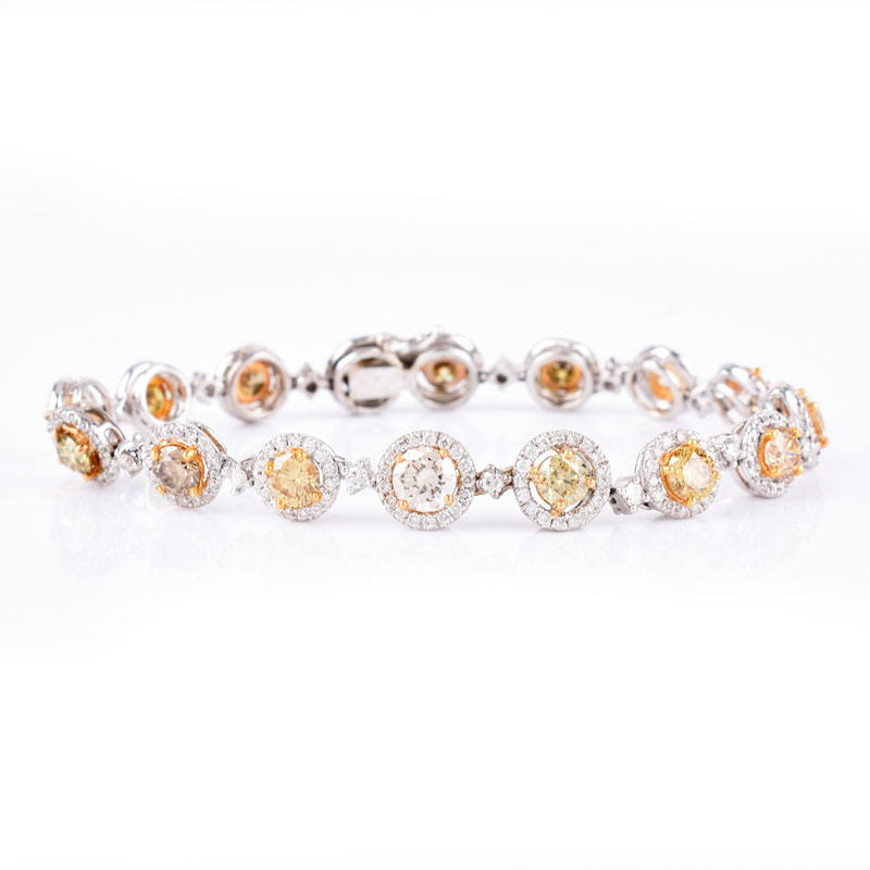 Approx. 6.0 Carat Round Brilliant Cut Fancy Multi Color Diamond, 3.0 carat Round Brilliant Cut White Diamond and Platinum Bracelet. 