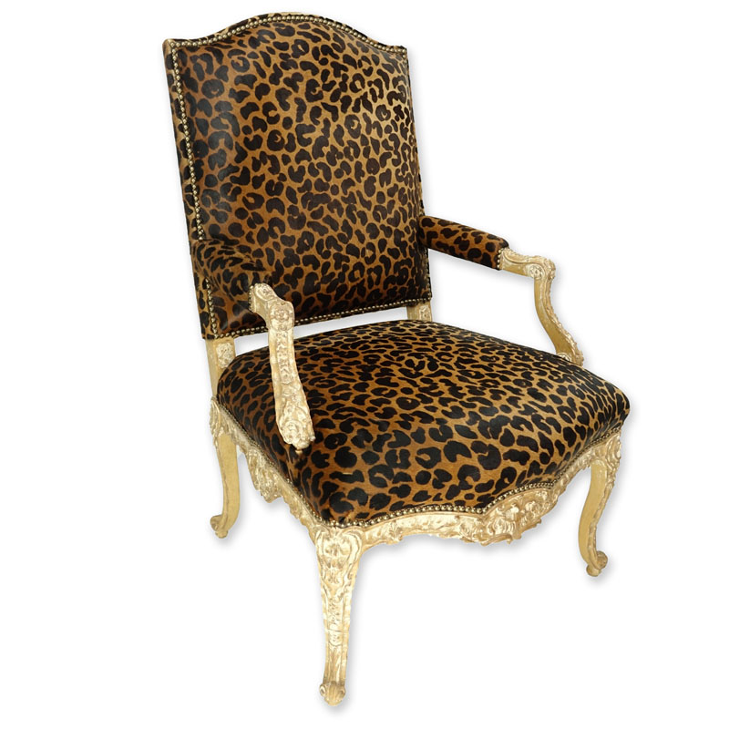Vintage Cow-Hide Upholstered and Carved Wood Fauteuil Chair. Stencil cheetah print on upholstery and distressed floral carved frame.