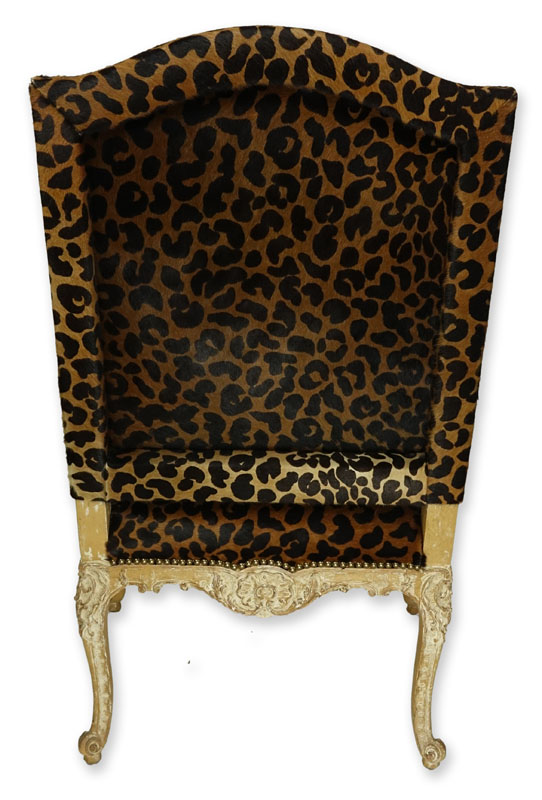 Vintage Cow-Hide Upholstered and Carved Wood Fauteuil Chair. Stencil cheetah print on upholstery and distressed floral carved frame.